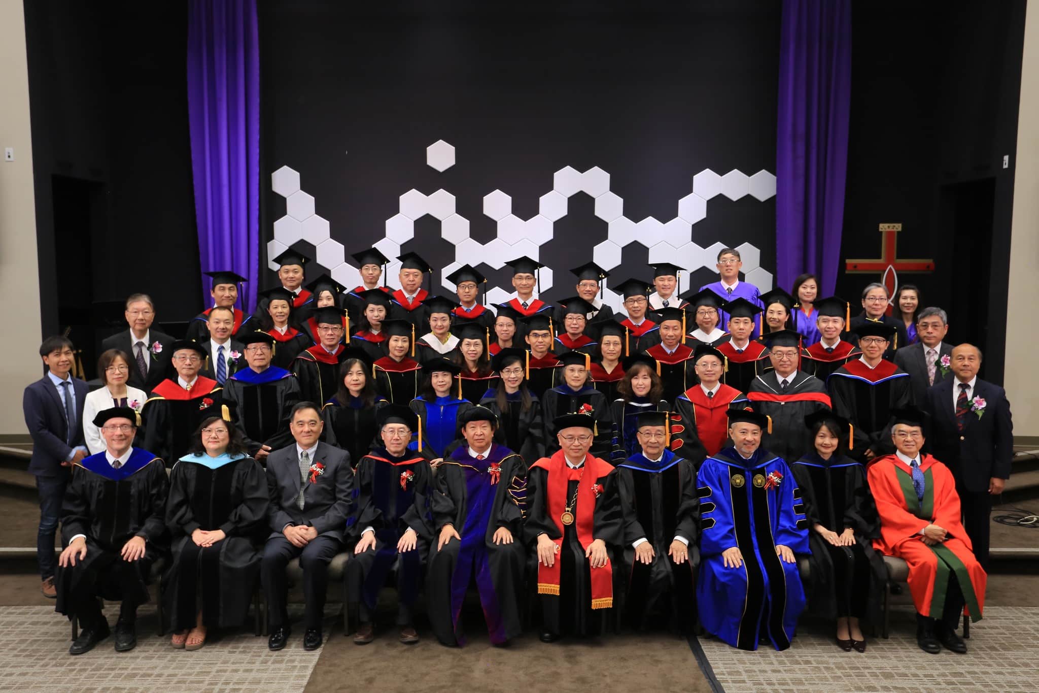 Graduates and faculty in a group photo at Logos Evangelical Seminary